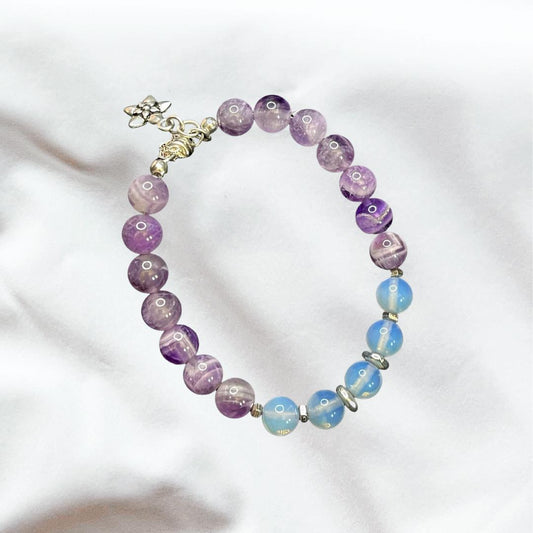 Front viOverhead view of Chevron Amethyst Bracelet and Opalite Gemstone Bracelet; 8 mm beads; sterling silver magnetic clasp; sterling silver spacer beads and flower charm.